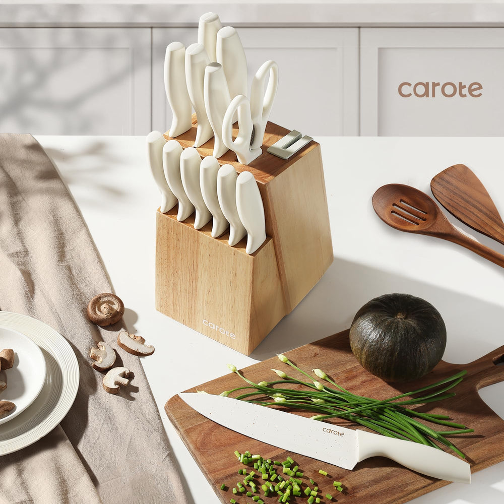 CAROTE knife set displayed on countertop emphasizes modern kitchen aesthetics.