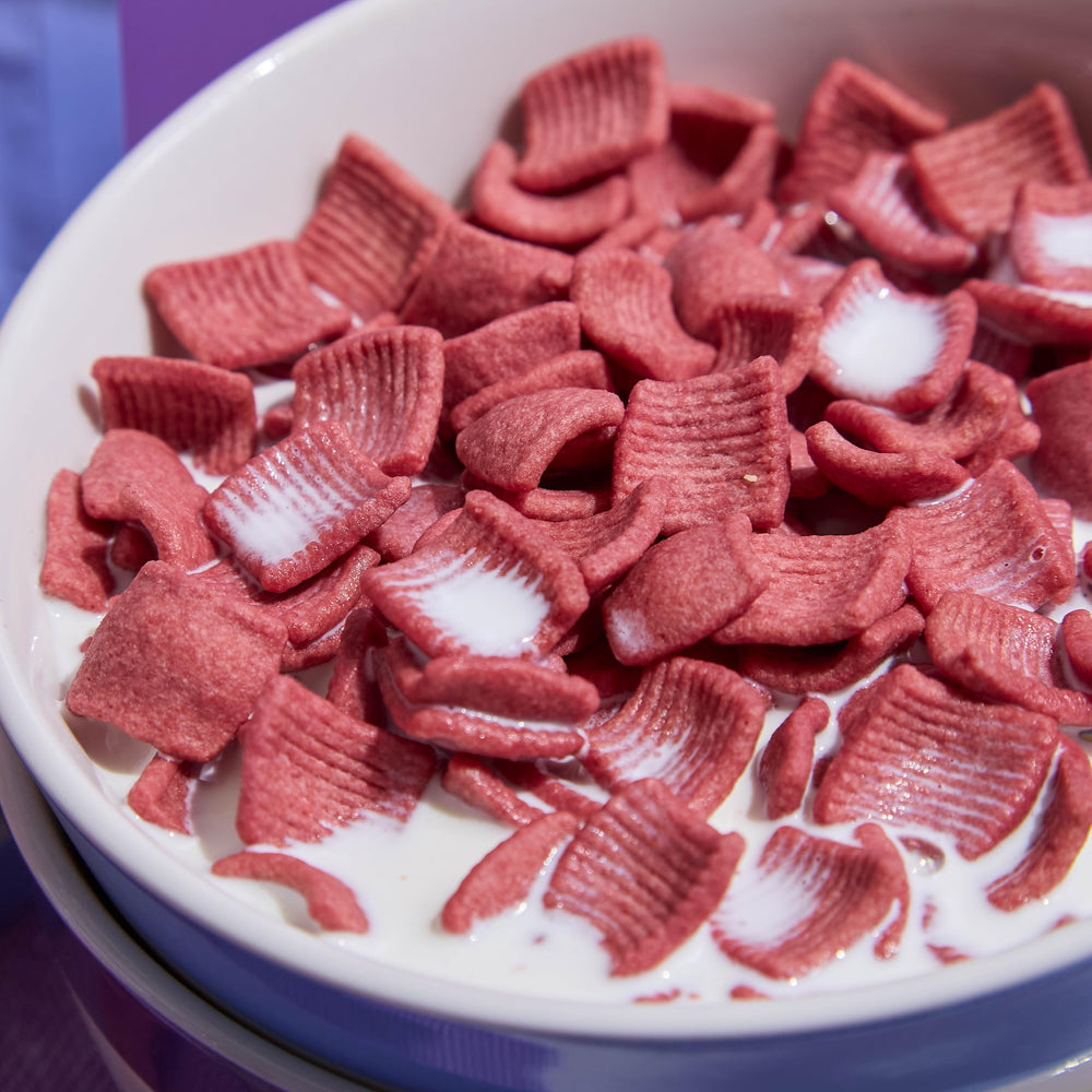 Catalina Crunch cereal serving with berries suggests versatile morning ritual.