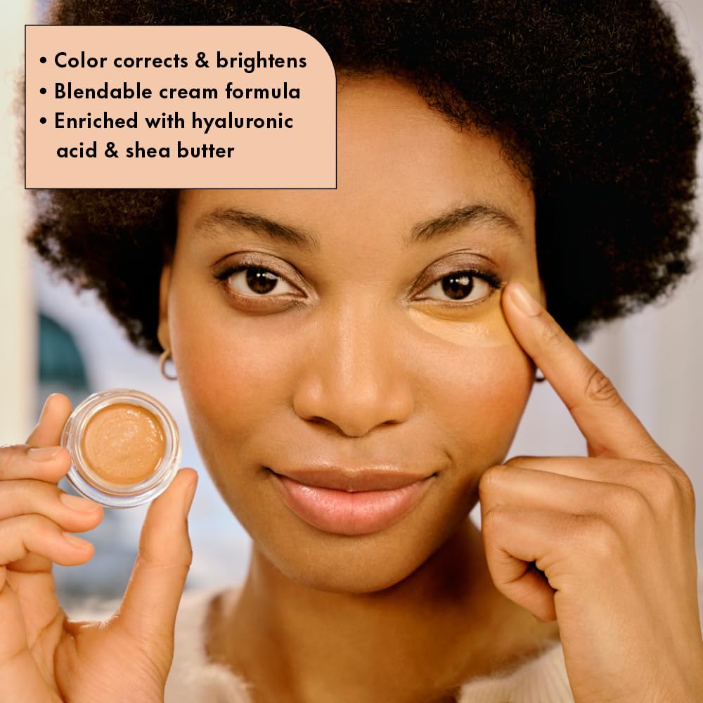 Catrice Under Eye Brightener warm-tone shade applied under-eye for natural brightness.