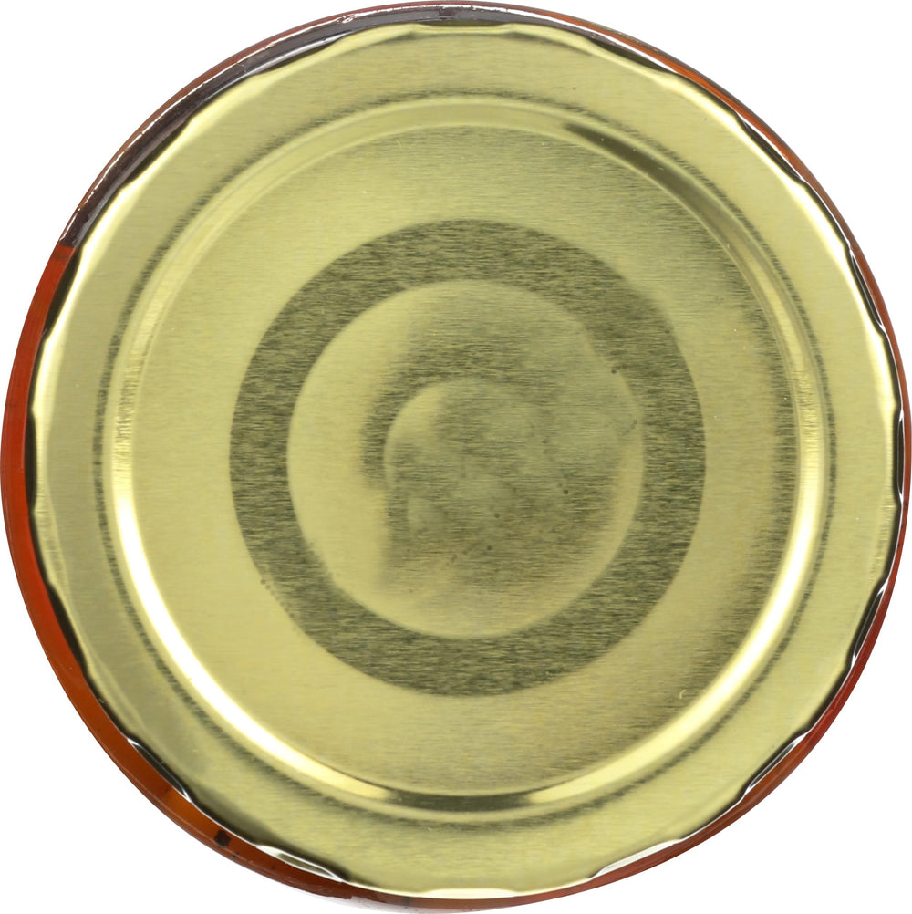 Sliced Cento peppers in a jar shown over a tilting angle for clarity