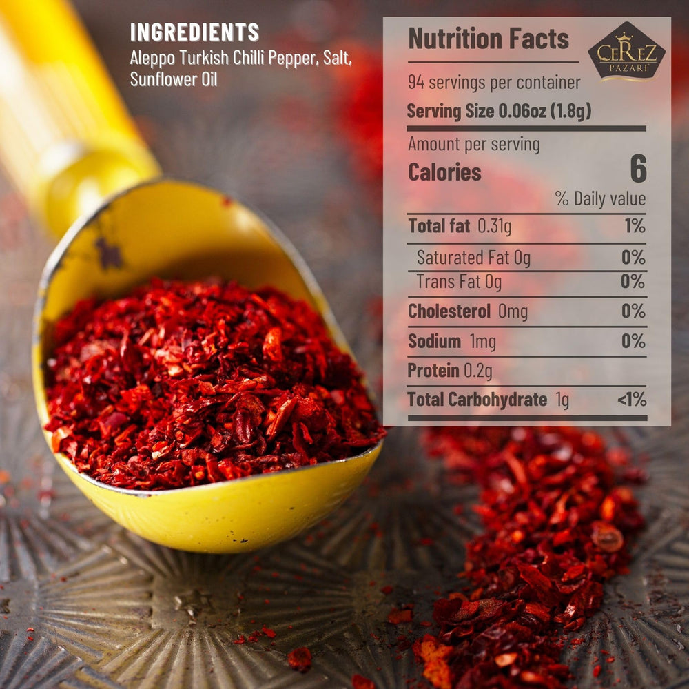 Close-up of crushed Aleppo Pepper flakes with bright color and fruity undertones.