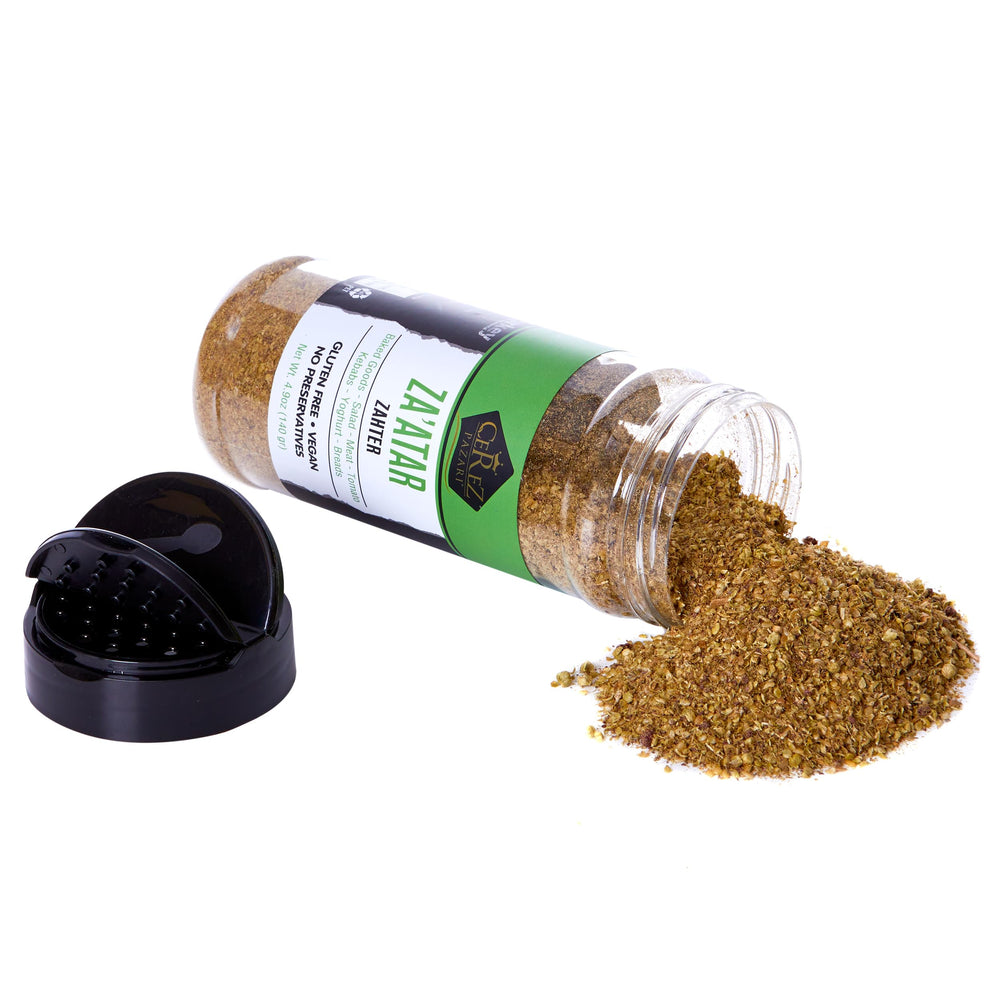 Çerez Pazarı Zaatar spice blend jar with fresh herbs for vibrant flavor.