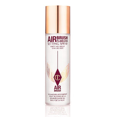 Charlotte Tilbury Airbrush Flawless Setting Spray bottle close-up showing sleek design and mist.