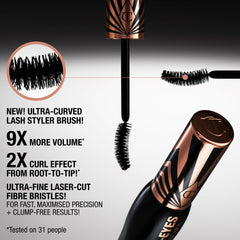 Charlotte Tilbury Exagger-Eyes ultra-curved lash brush in a glass bottle setting.