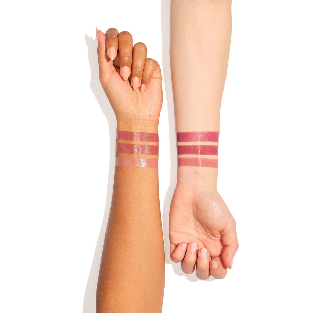 Charlotte Tilbury Hollywood Lip Trio flatlay with shades and accessories.