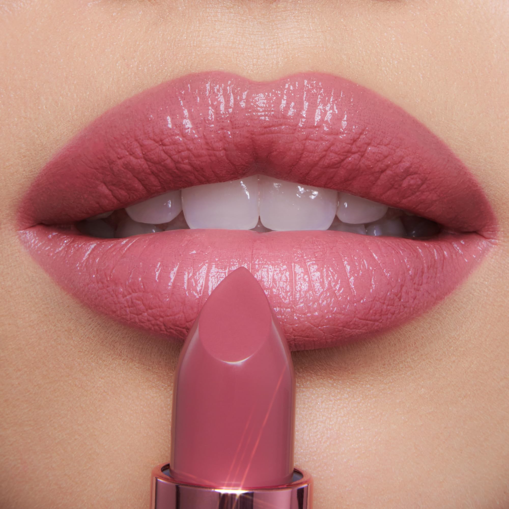 Charlotte Tilbury K.I.S.S.I.N.G mini pink swatch shows radiant rosy payoff.