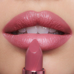 Charlotte Tilbury K.I.S.S.I.N.G mini pink swatch shows radiant rosy payoff.