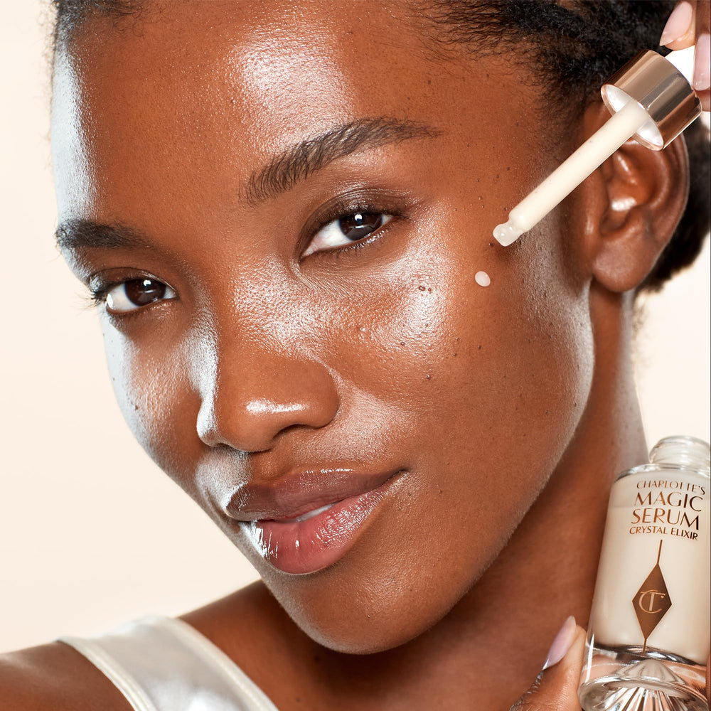 Luxurious vanity display featuring Charlotte Tilbury Magic Serum Crystal Elixir