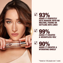 Charlotte Tilbury setting spray mist on the face demonstrates even application and refreshing finish.
