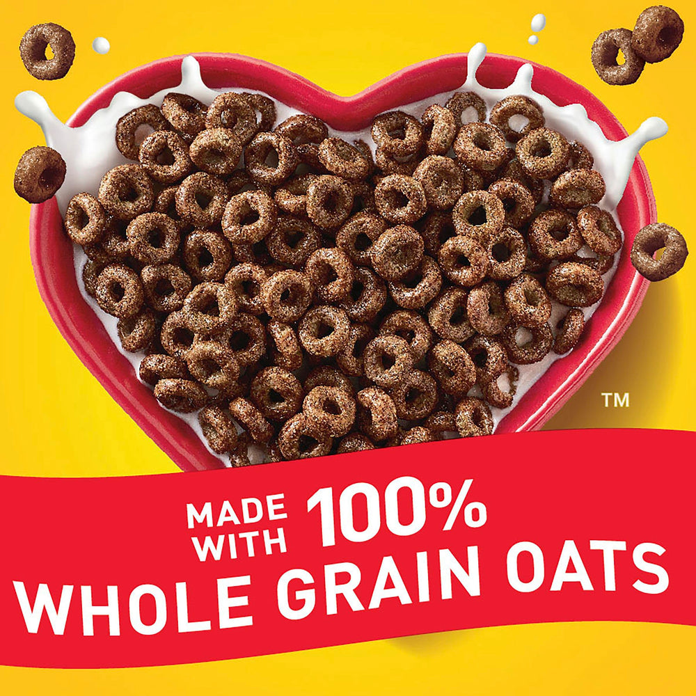Cheerios Chocolate spoon-tasting a crunchy, chocolatey bite.