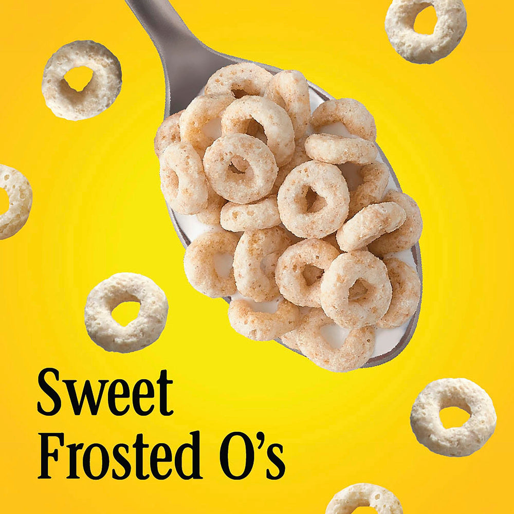 Pouring Cheerios Frosted into a bowl, crisp texture and sweet taste.