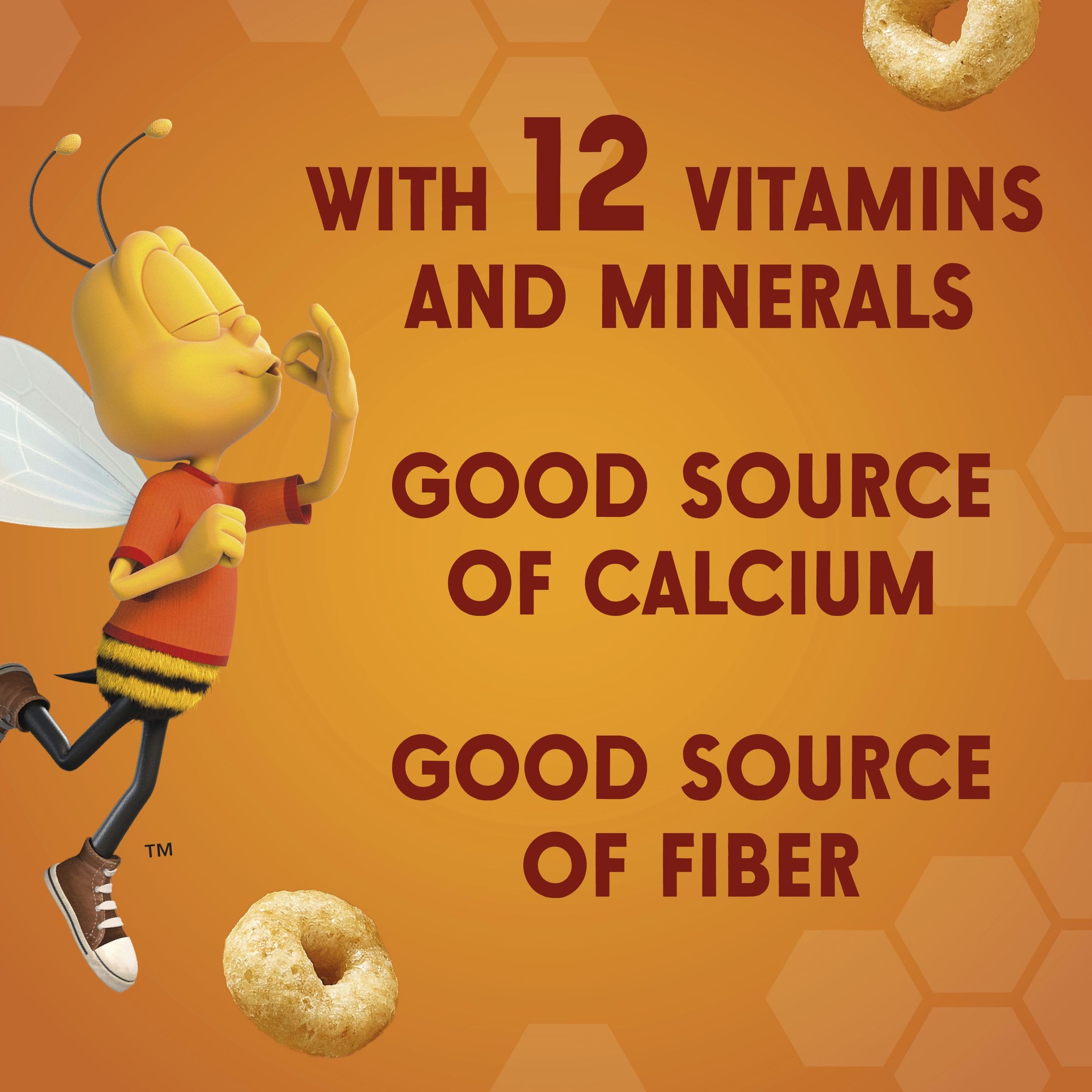 Milk being poured over Cheerios Honey Nut cereal