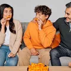 Cheetos Puffs close-up shows crunchy, airy texture and cheesy coating.