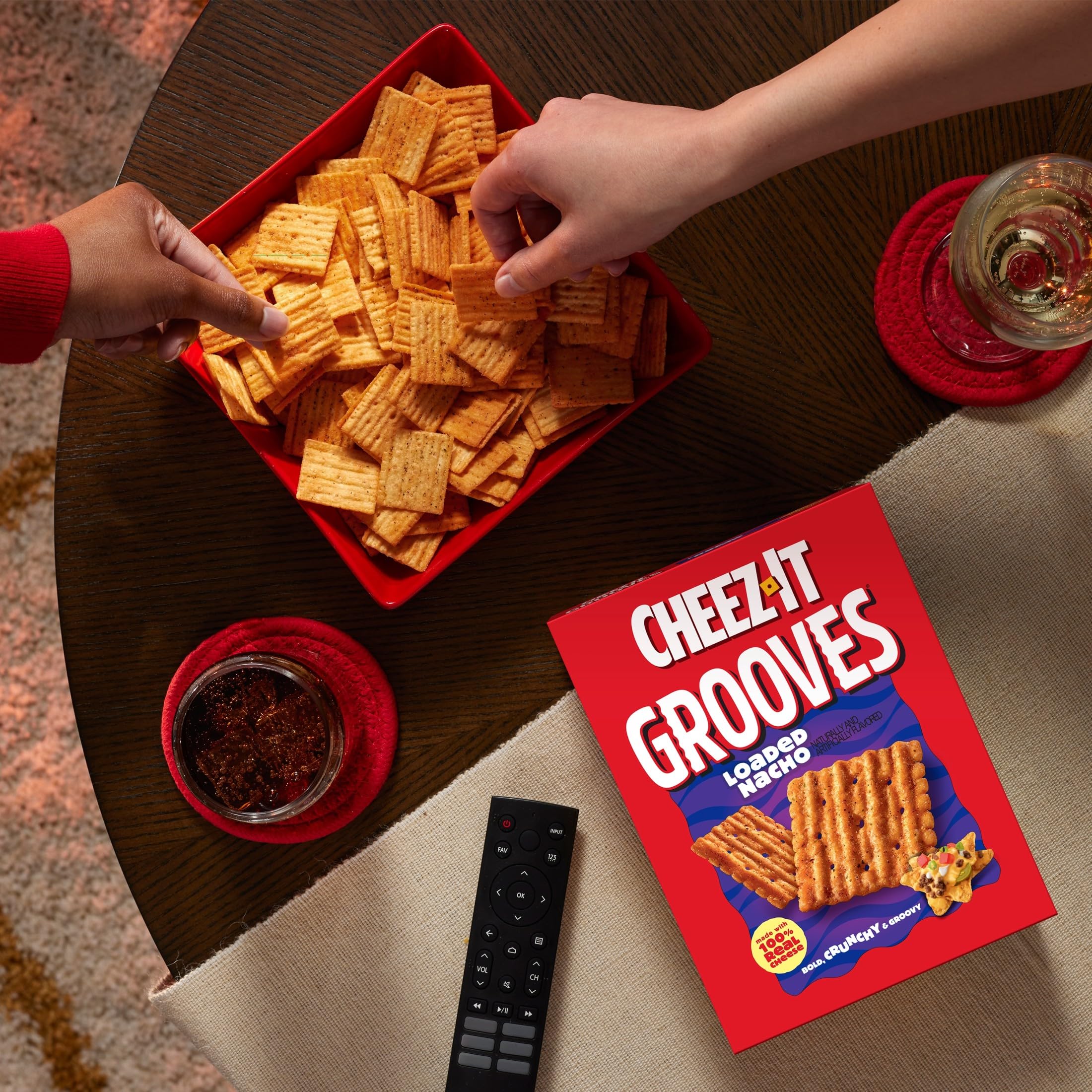 Office desk scene with Cheez-It Grooves Loaded Nacho as a snack
