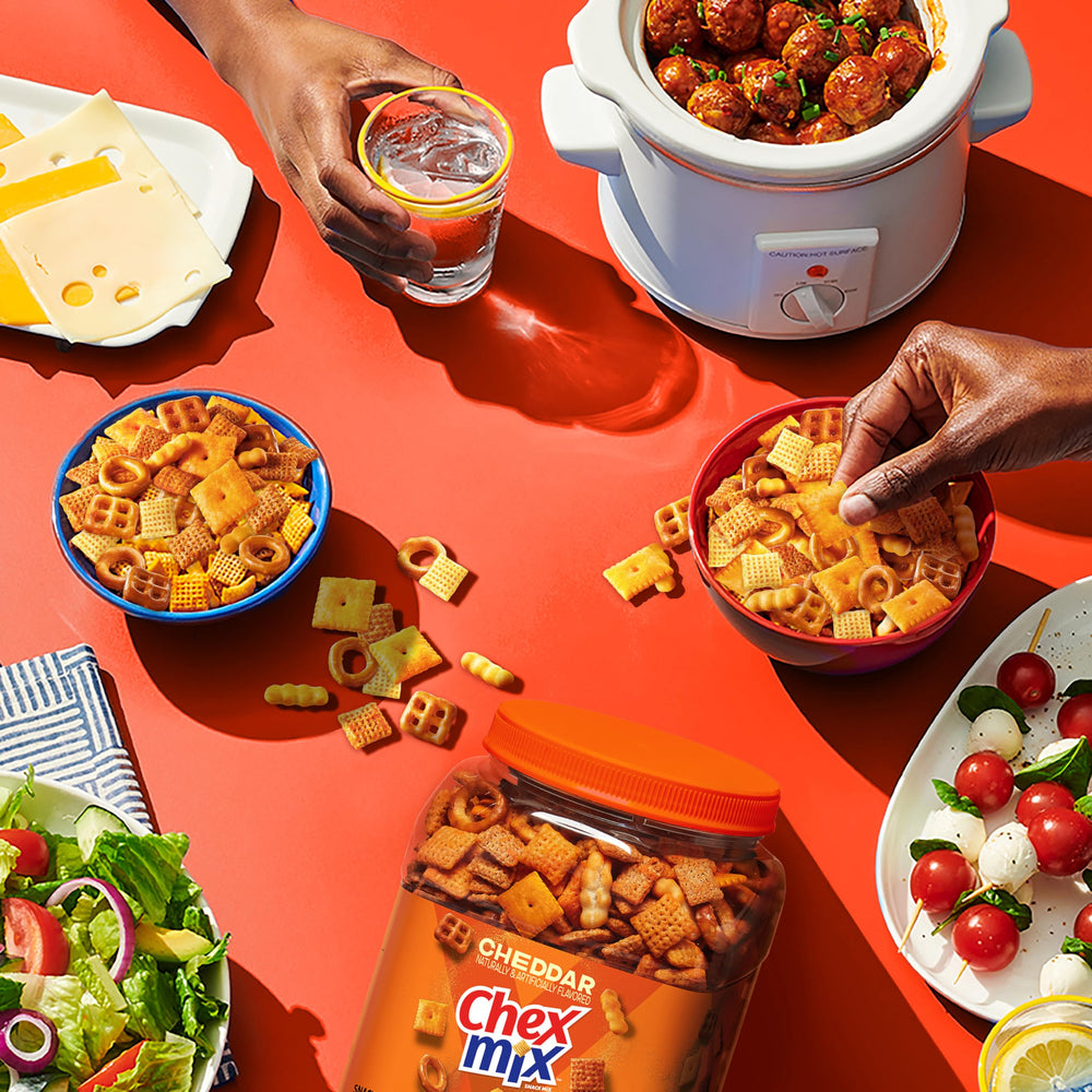 Chex Mix Cheddar Snack party setup highlighting a mix of shapes.