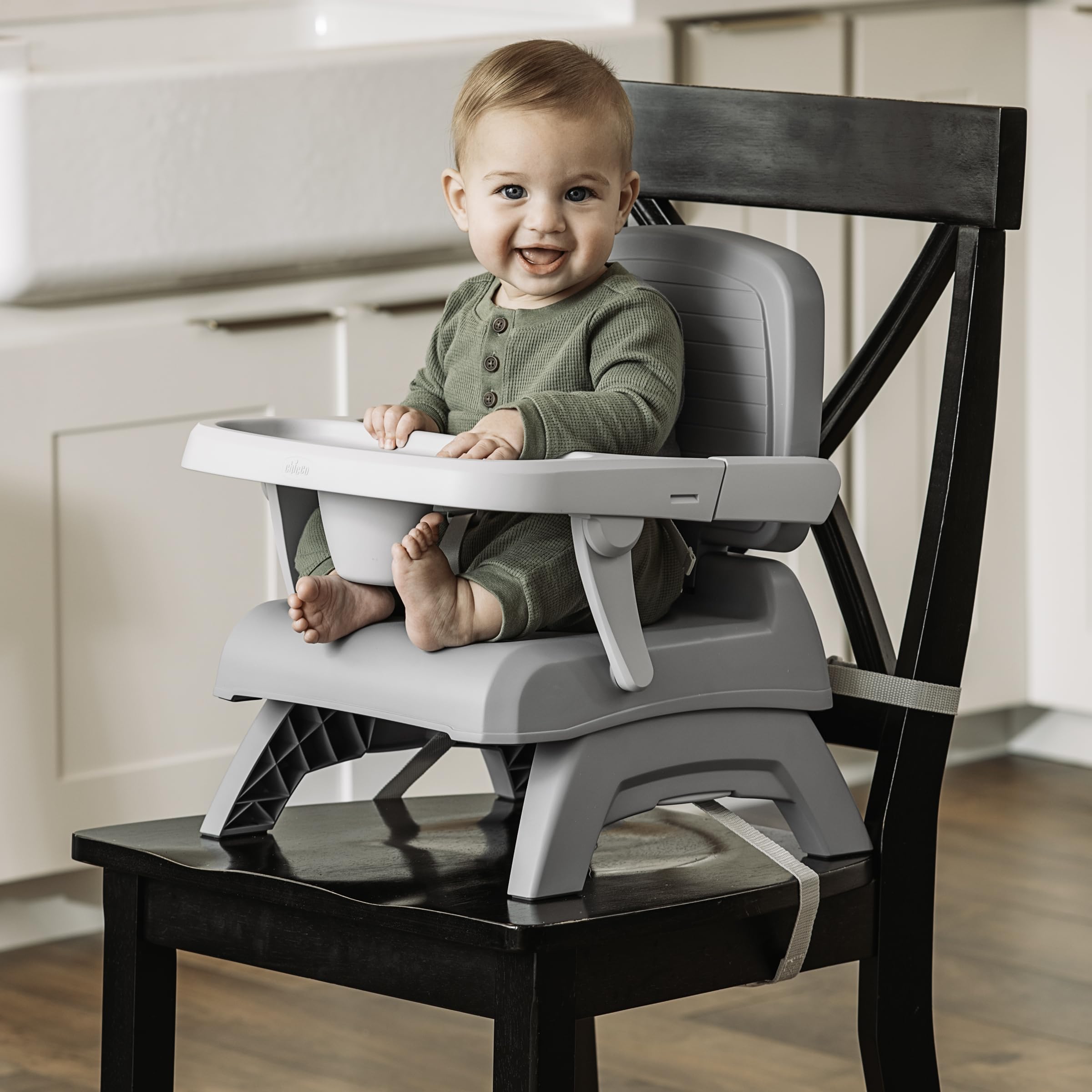 Chicco Bento Booster shows two height positions for growing toddlers.