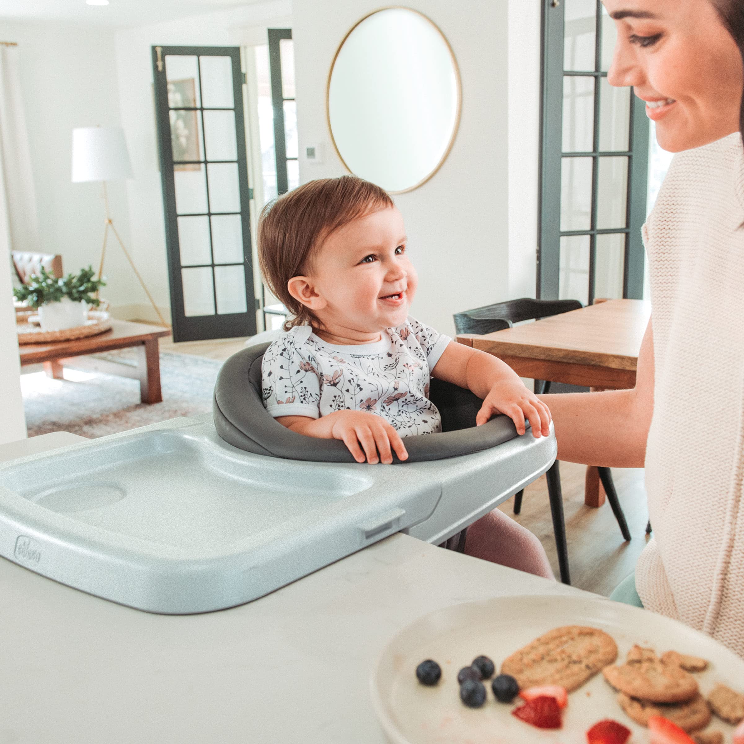 Chicco FastLock clamps secure to tables with rubberized feet protection.