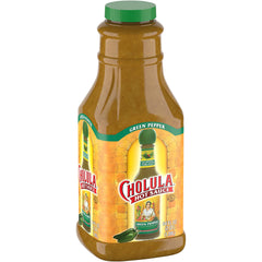 Cholula Green Pepper Hot Sauce bottle on shelf for versatile flavor.