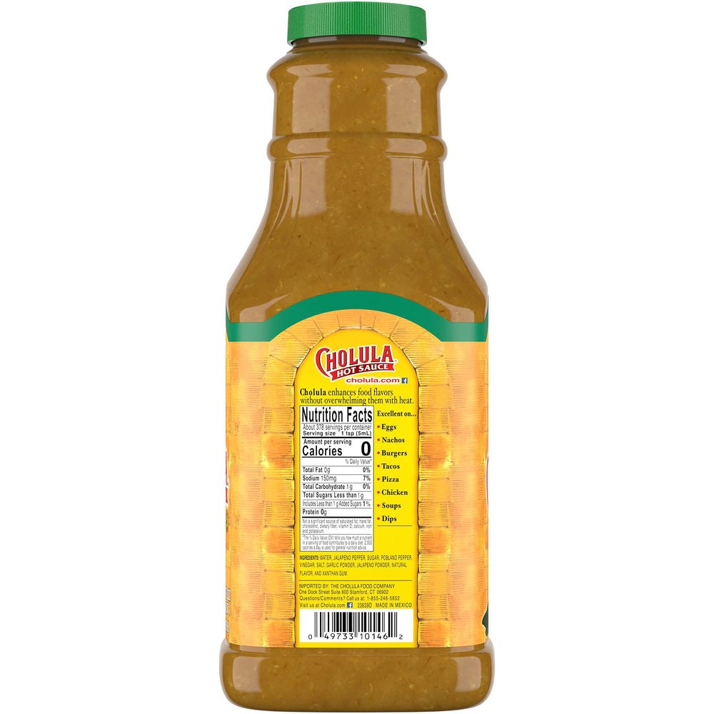 Cholula Green Pepper Hot Sauce bottle pouring over eggs for balanced heat.