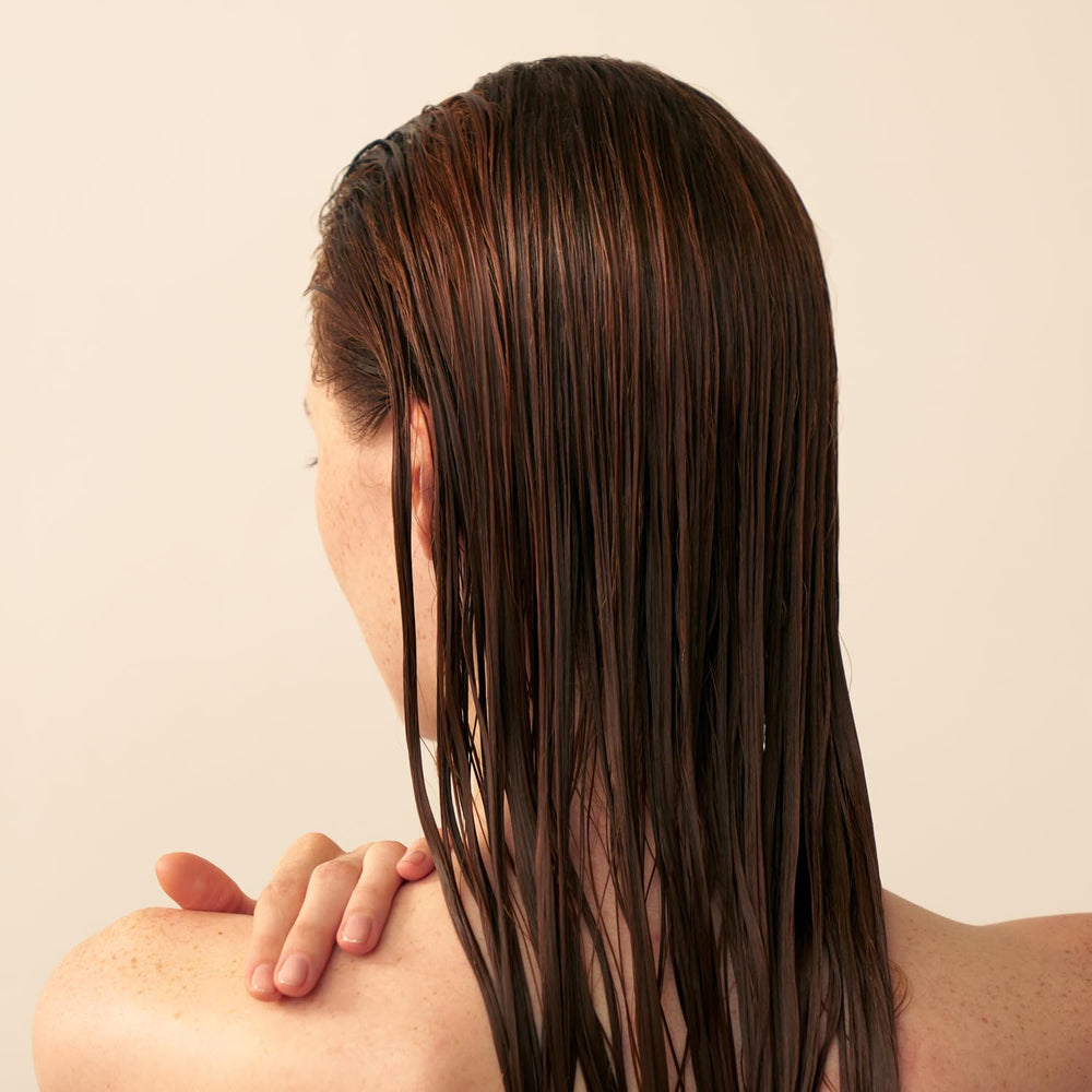 Christophe Robin conditioner swatch showing soft, hydrated hair after use.