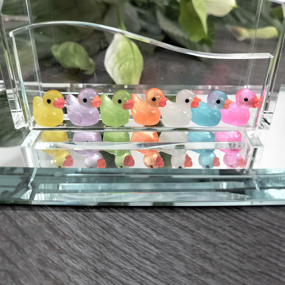 Cidinge resin ducks serve as garden ornaments with whimsical touch.