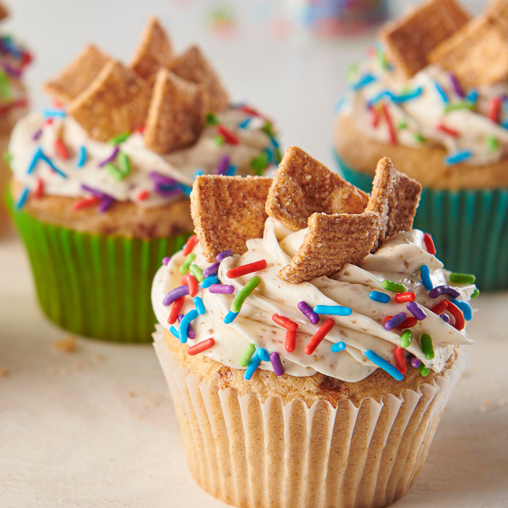Cinnamon Toast Crunch topping on cupcakes for a cinnamon treat.