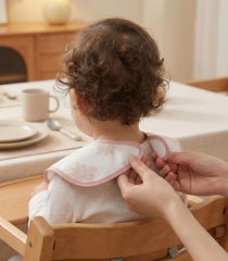 Civarua Kids pink blossom bibs, adjustable shoulder closure for ages 3–24 months.