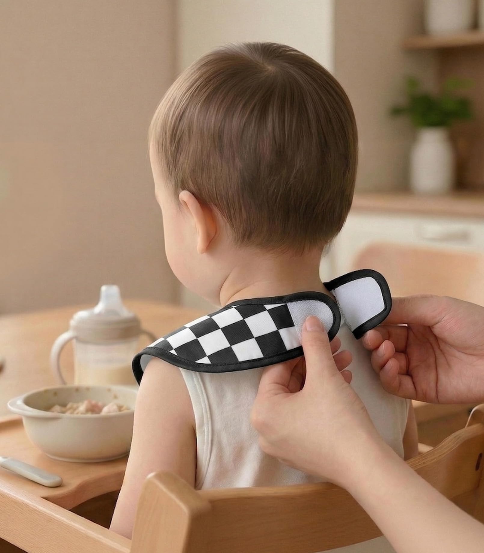 Civarua Kids Cherkerd bib in use on toddler during self-feeding