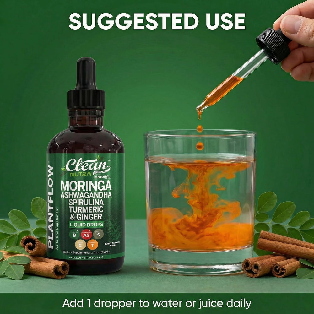 Clean Nutraceuticals Moringa Drops on a desk beside a notebook.
