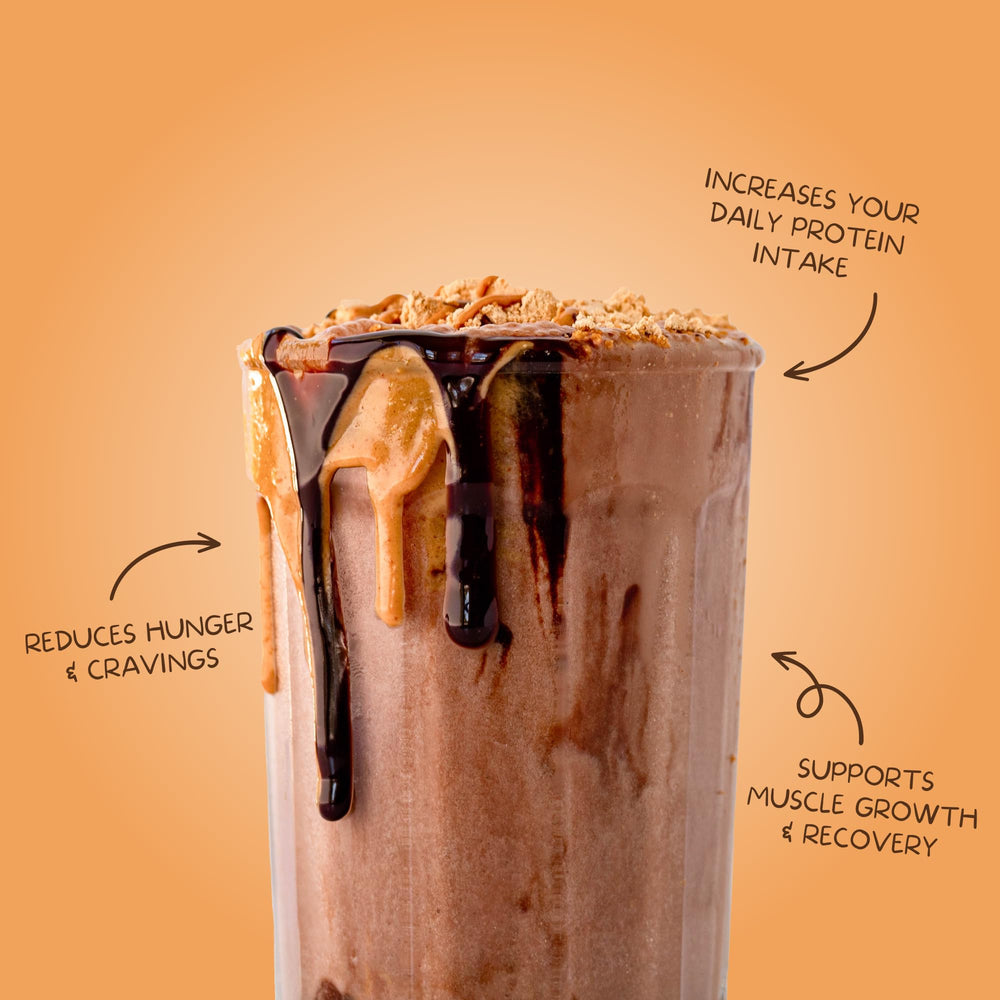 Clean Simple Eats chocolate peanut butter protein scoop over oats, ready to mix into recipes.