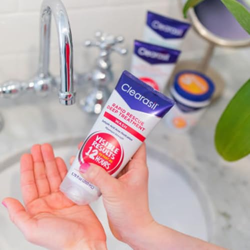 Drying face with a soft towel after using Clearasil wash