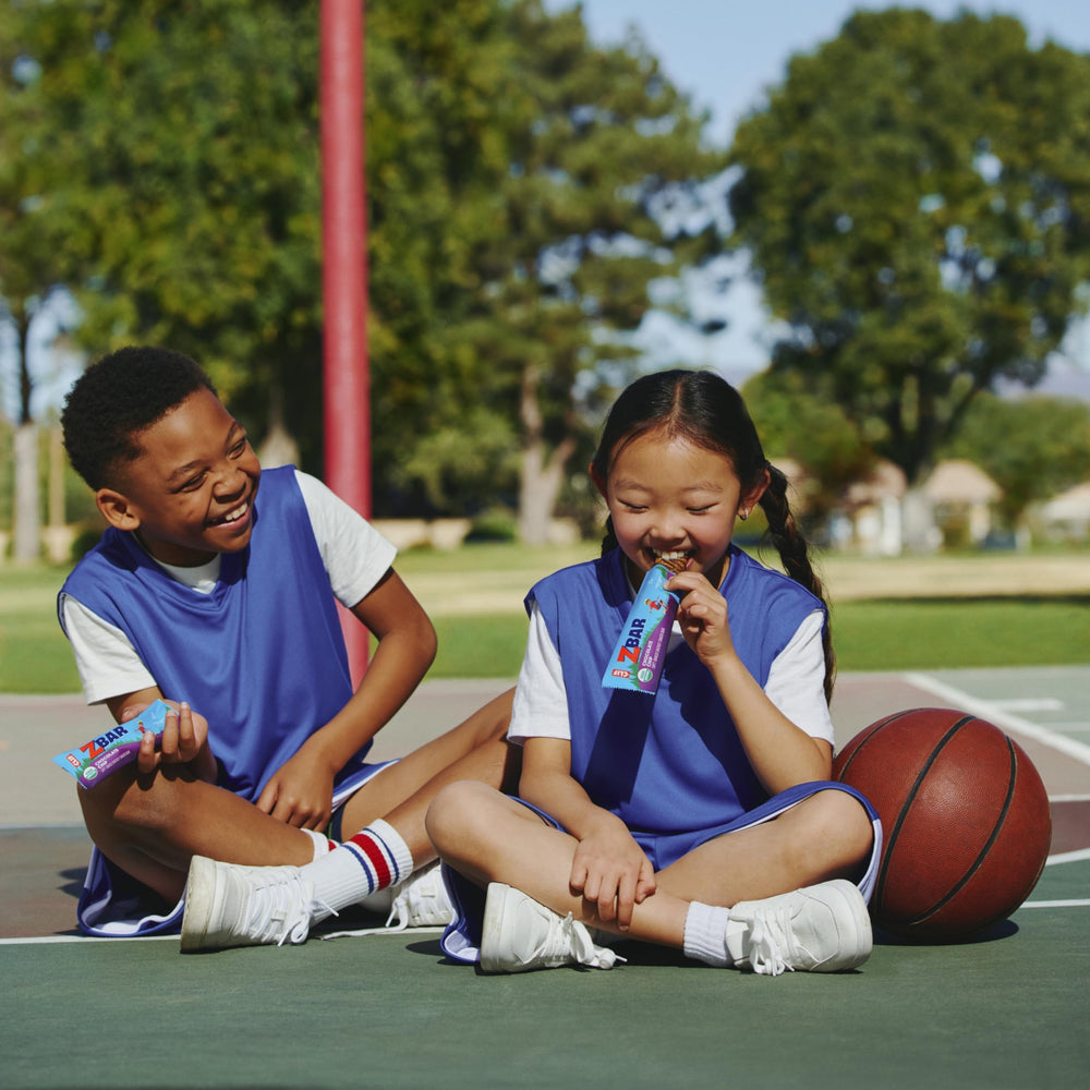 Clif Kid ZBar Chocolate Brownie kids holding image illustrates quick fuel between activities.