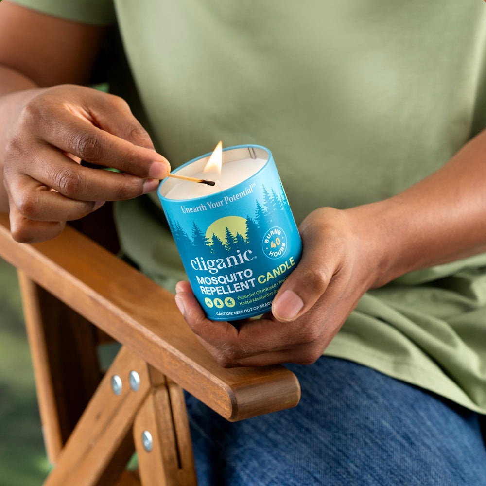Outdoor camping scene with Cliganic candle for safe nights.