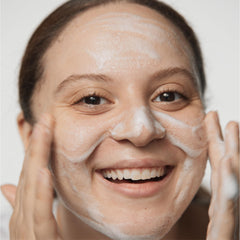Clinique Acne Solutions cleansing foam packaging and bottle for daily routine.