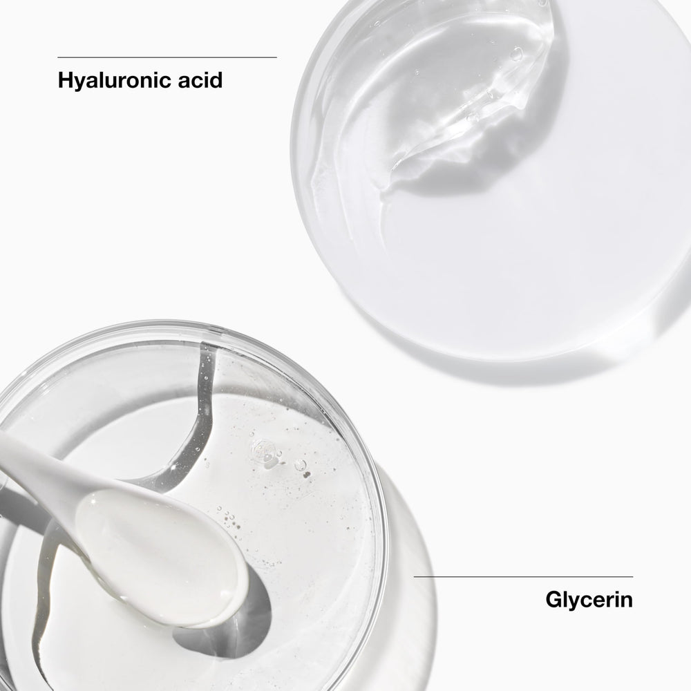 Hands applying Clinique All About Clean foam on the face for cleansing.