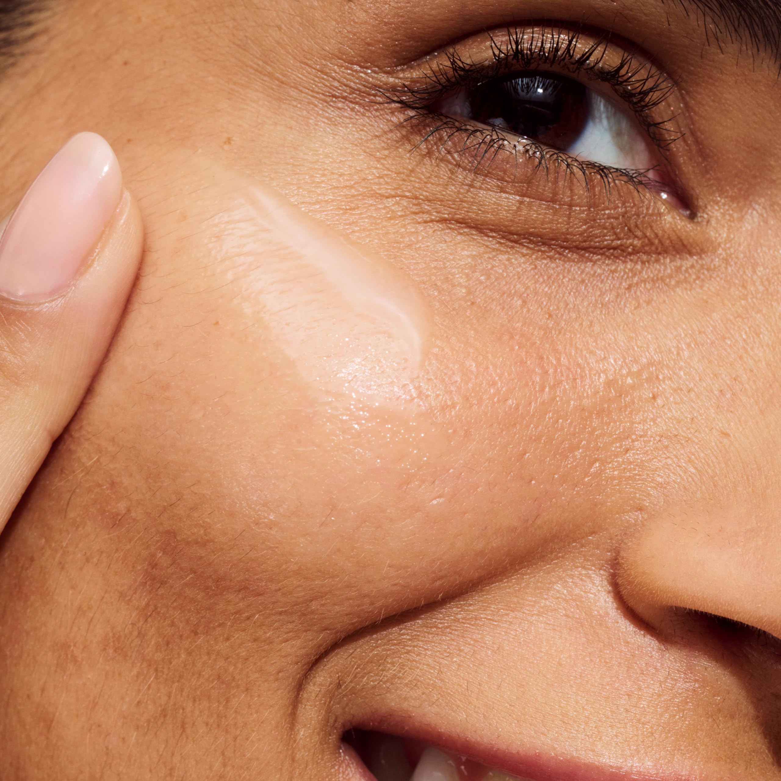 Close-up of Clinique Even Better serum texture showing non-greasy, fast-absorbing formula.