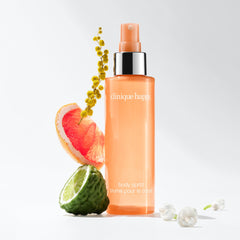 Clinique Happy Body Spritz spray-dispense in action delivering a light mist