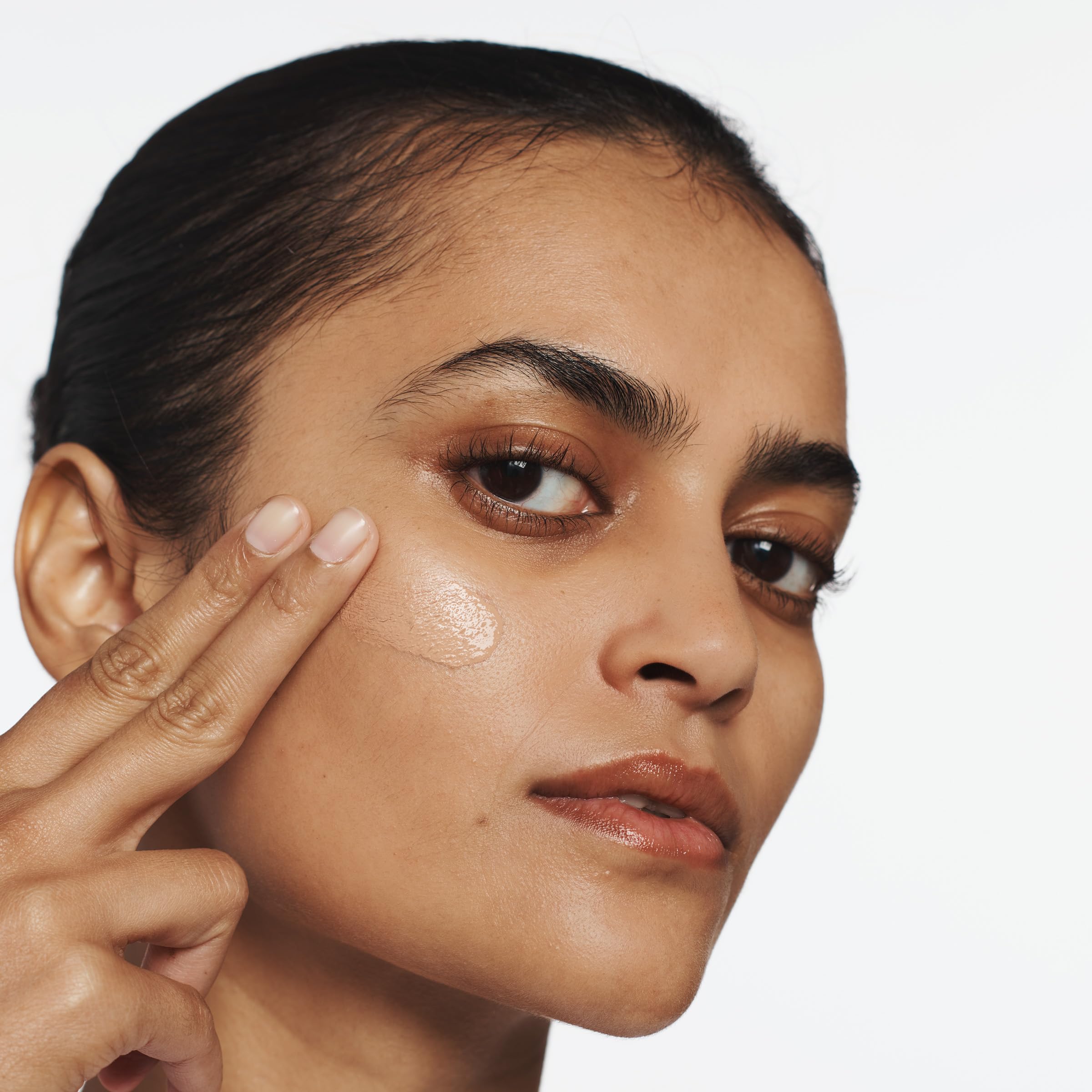 Clinique Superbalanced foundation texture swatch showing natural finish on skin.