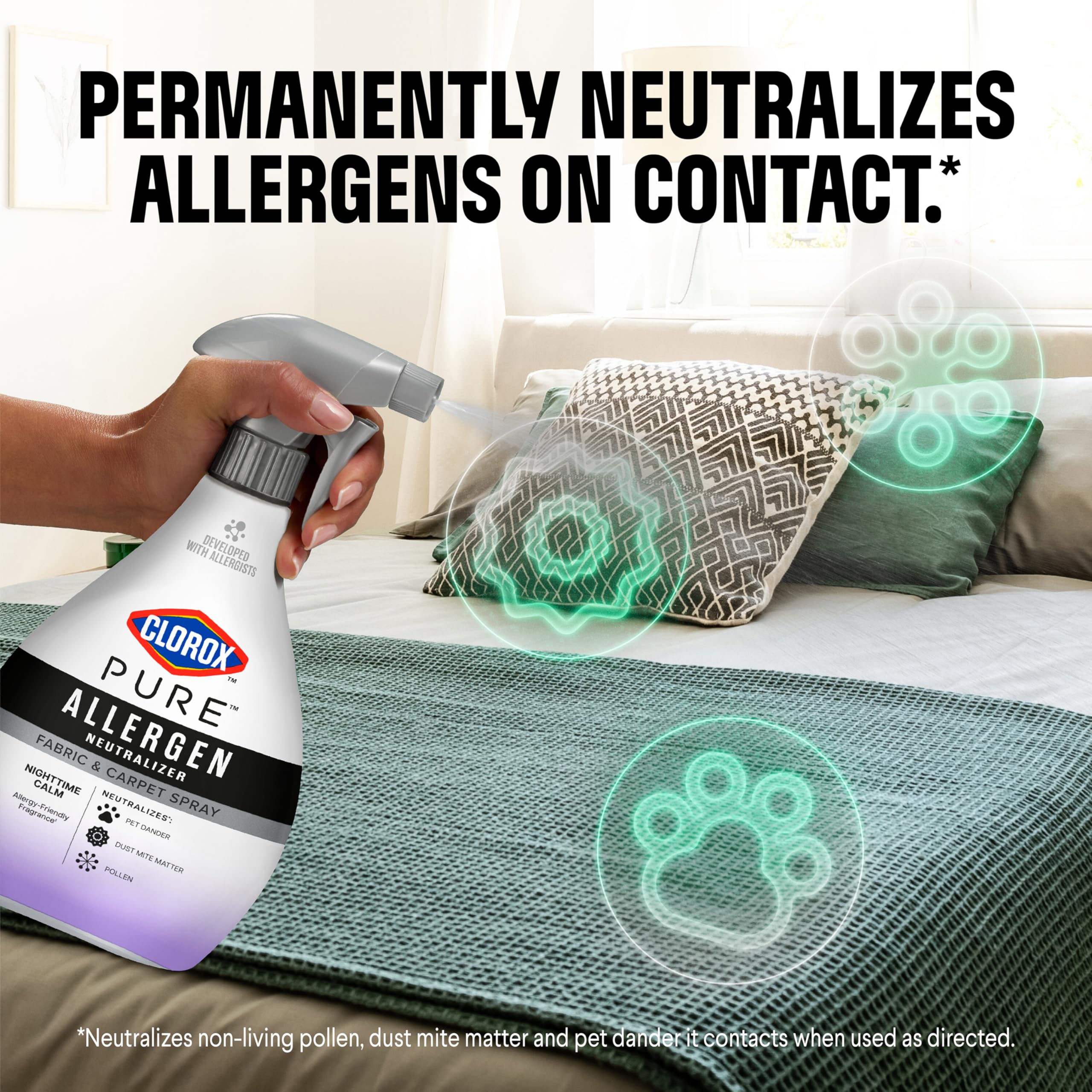 Clorox PURE Allergen Neutralizer sprayed on a couch fabric for allergen relief.