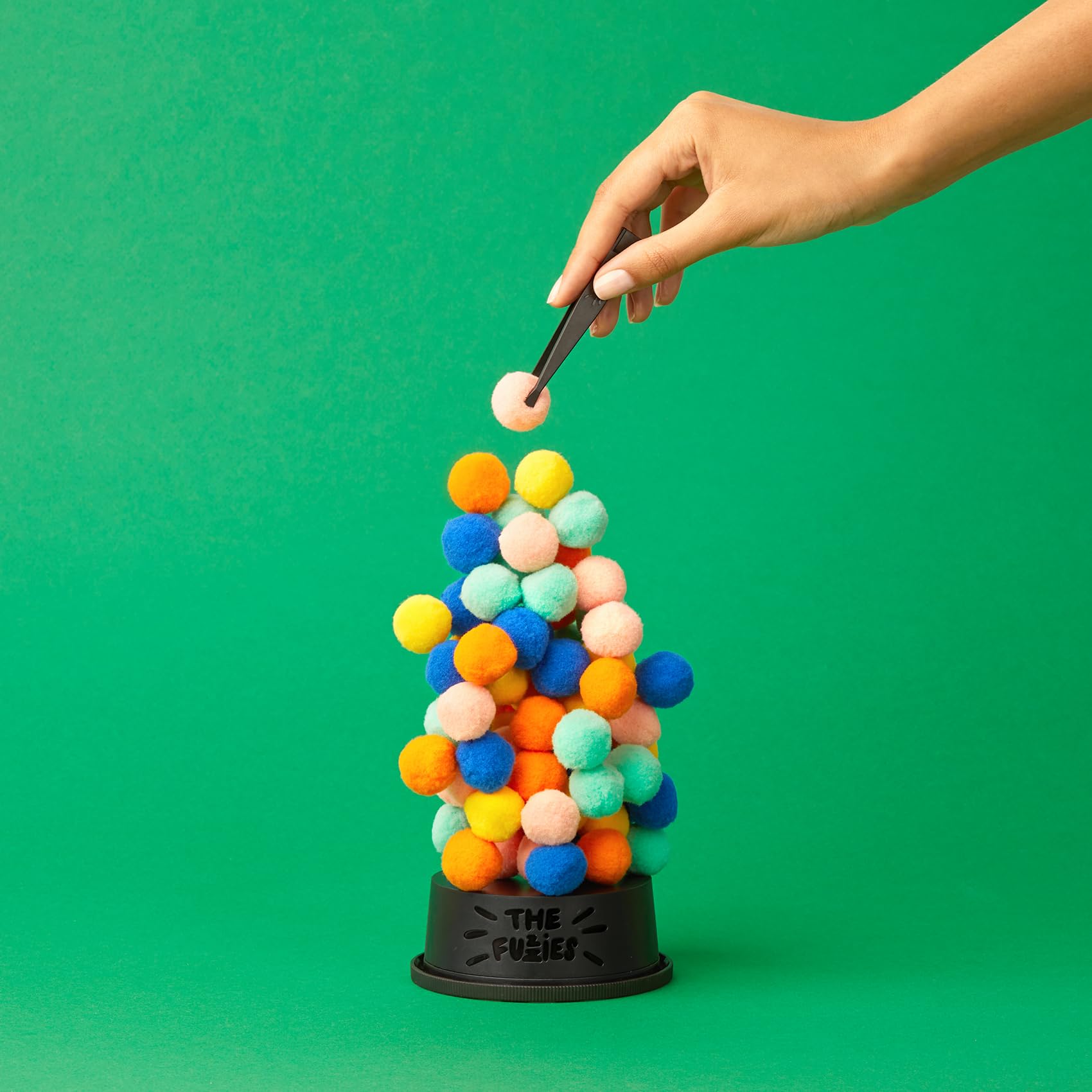 CMYK The Fuzzies: gravity-defying stacking with squishy, satisfying play.