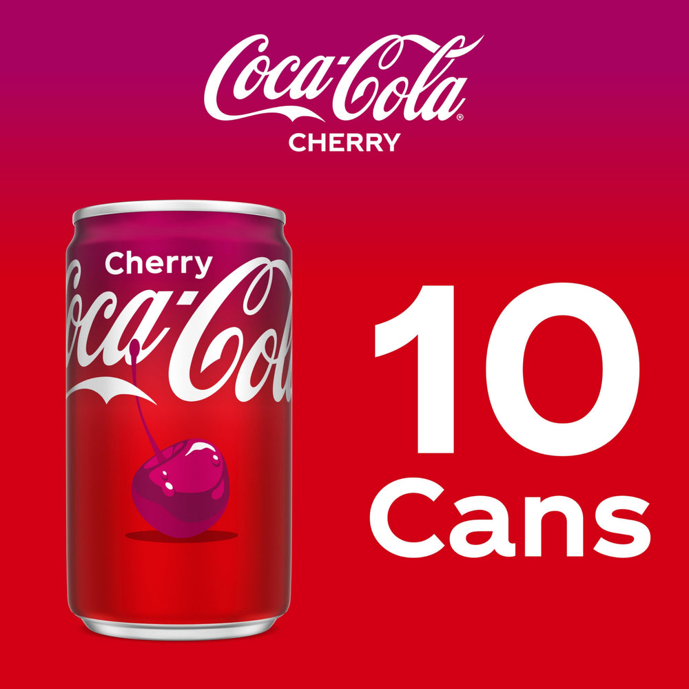 Coca-Cola Cherry can in hand during casual break.