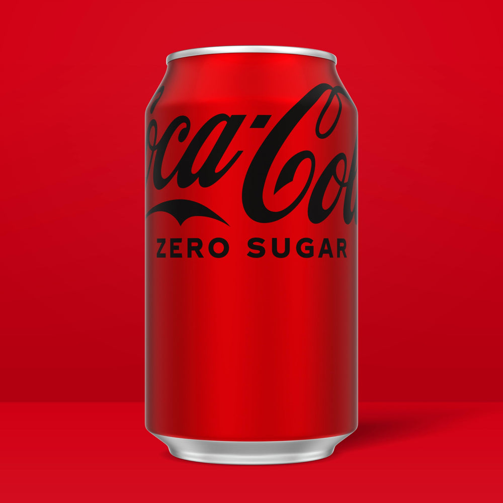 Coca-Cola Zero 12oz can pour into glass showing refreshing fizz, great with meals.