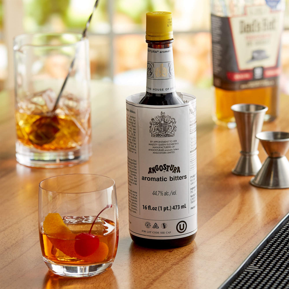 Cocktail glass with Angostura bitters suggesting balanced flavors.