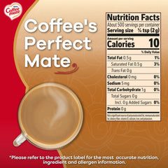 Scoop beside Coffee Mate Original powdered creamer ready for even mixing.