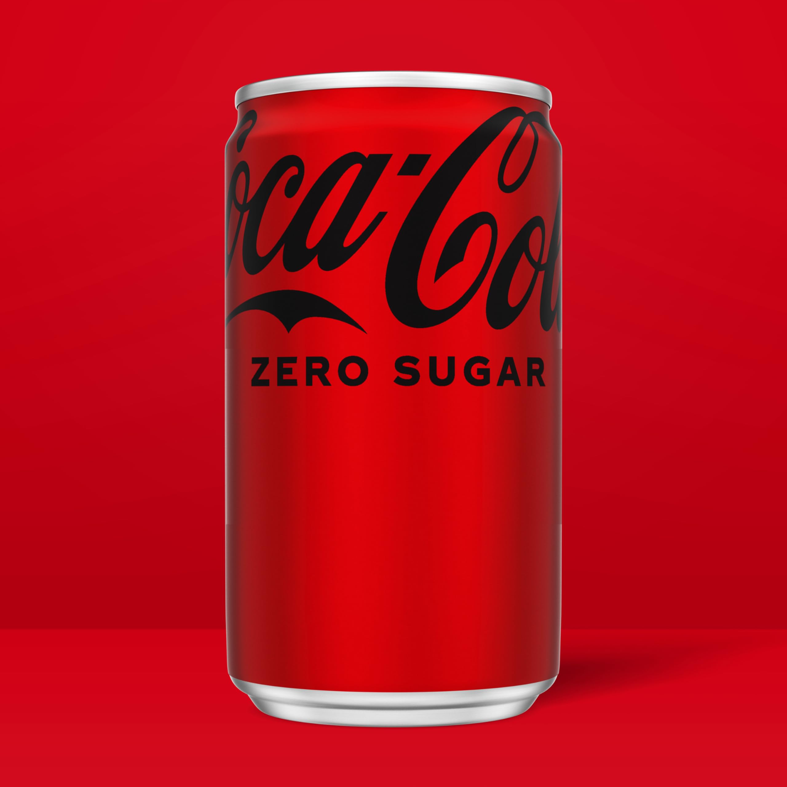 Coke Zero Sugar mini-can label close-up emphasizes allergen-free formula.