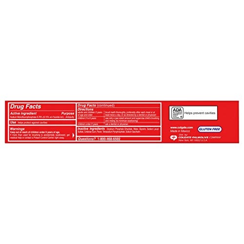 Colgate Cavity Protection toothpaste tube closeup shows fluoride for enamel strengthening.