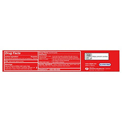 Colgate Cavity Protection toothpaste tube closeup shows fluoride for enamel strengthening.