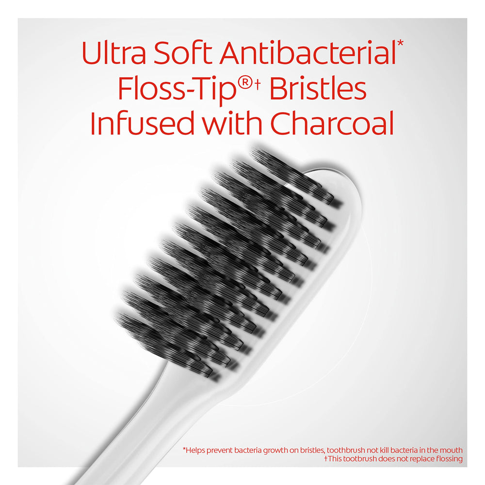 Colgate Gum Health Charcoal toothbrush cleaning along the gum line