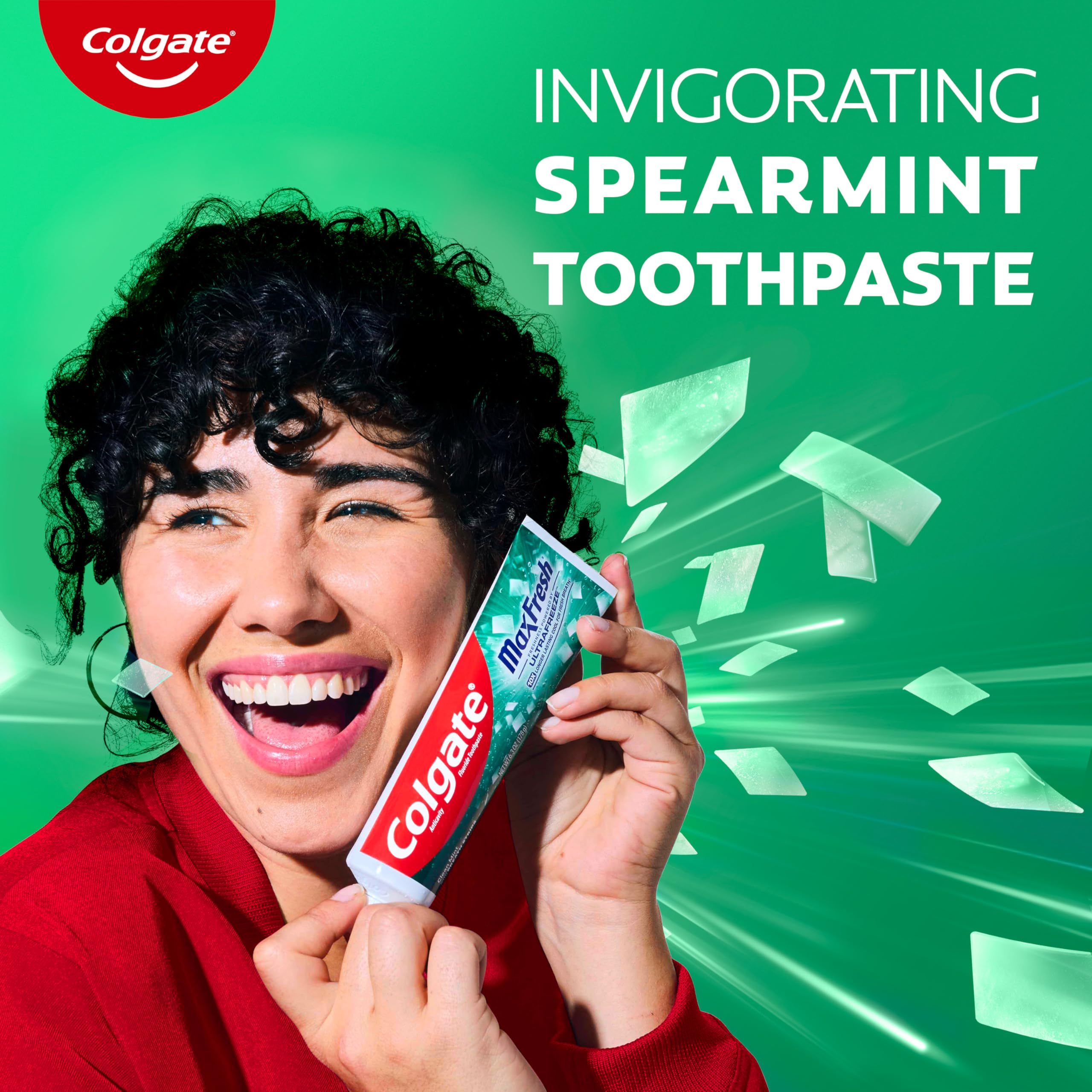 Colgate MaxFresh mint swirls illustrate invigorating brushing experience.