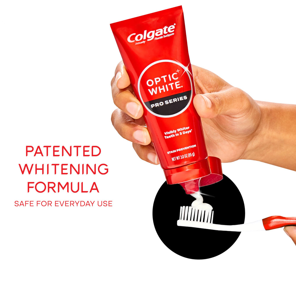 Hands brushing Colgate Optic White Pro Series toothpaste showing enamel-safe formula.